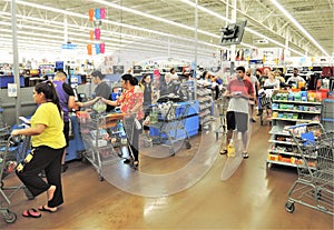 Crowd of shoppers waiting in line to check out.