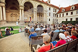 Crowd of spectators listening to the choir at the Royal Palace