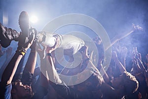 Crowd surfing at a concert