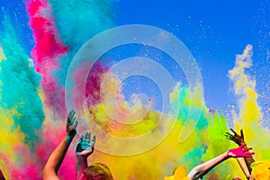 Crowd throws colored powder at holi festival