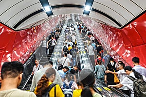 The crowd took the elevator in subway tunnel in Guangzhou, China