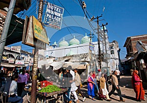 Crowd of walking people on the street with market