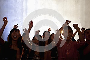 A crowd of young people dancing in a nightclub