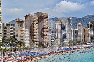 Crowded beach of Benidorm on a cloudy day