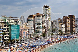 Crowded beach of Benidorm on a cloudy day