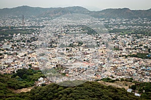 crowded city houses landscape with misty mountain background at morning from flat angle