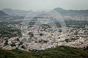 crowded city houses landscape with misty mountain background at morning from flat angle