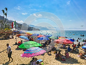 Crowded colorful puerto vallarta tropical mexican beach