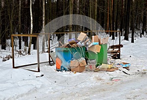 Crowded dumpster. Garbage waste scattered on the road. Ignoring garbage disposal utilities.