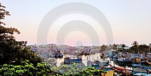 A crowded fishing fish shipping ship boat river sea at dusk dawn in Asia Vietnam