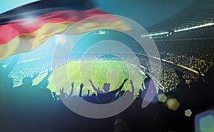 Crowded football stadium with german flag
