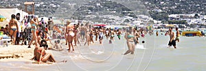 Crowded italian beach summer scene panorama with people. Puglia, Italy