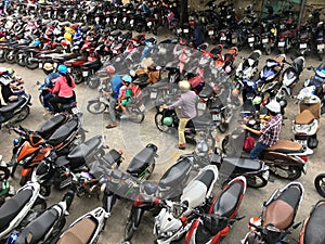 Crowded parking with motorbikes near hospital in Vietnam