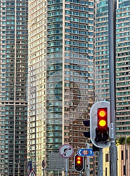 Crowded residential apartment buildings in Hong Kong downtown with traffice lights