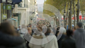 Crowded street Champs-ElysÃ©e in Paris. Tourists.