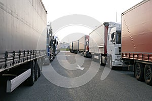 Crowded truck parking lot. Drivers try to park so as to take up as little space as possible