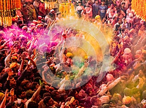 Crowds can be seen below duirng Holi Festival in India, throwing