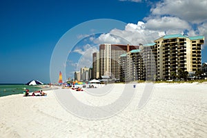 Crowds dot the beach in Panama City Beach, FL