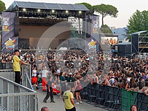 Crowds, hundreds of People, waiting for the Concert to begin and the Stage still Empty without the Singer