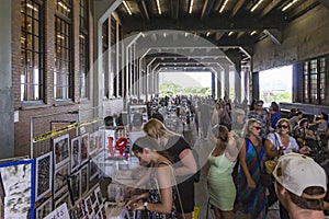 Crowds with many people on a covered market in High Line Park, New York, USA
