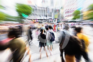crowds of people crossing the Shibuya crossing in Tokyo, Japan