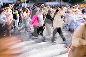 crowds of people crossing the Shibuya crossing in Tokyo, Japan