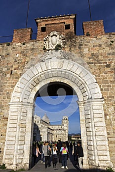 Crowds of tourists near Leaning Tower of Pisa in Italy