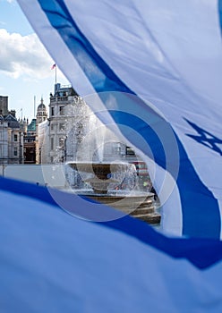 Crowds waving Israeli flags at pro-Israel rally in Trafalgar Square, central London, calling on Hamas to release the hostages.