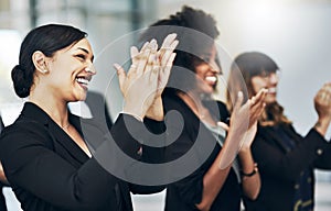 The crowed loved it. a group of businesspeople applauding during a seminar in the conference room.