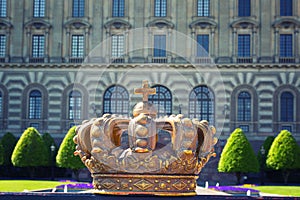 Crown on the background of the Royal Palace in Stockholm