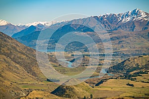 Crown Range Road Scenic Lookout, just outside of Queenstown, New Zealand, is a scenic spot on the high mountains