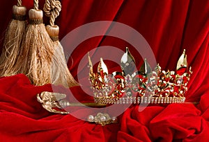 Crown and scepter on red velvet photo