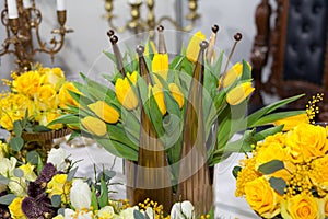 Crown shaped vase with yellow tulips