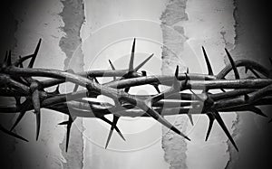 Crown of thorns on black wooden background. Christian symbol