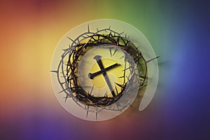 Crown of Thorns with cross in a multicolored background