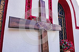 Crown of thorns hanging on a wooden cross