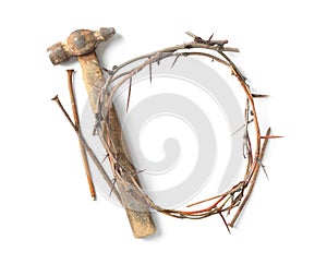 Crown of thorns, nails and hammer on white background, top view. Easter attributes