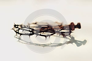 Crown of Thorns and Nails on Muted Background