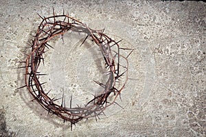 A crown of thorns on a stone texture background