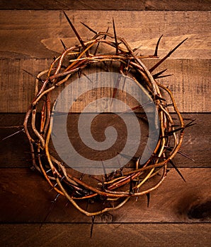 A crown of thorns on a wooden background. Easter Theme