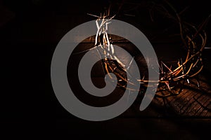 A crown of thorns on a wooden background. Easter Theme