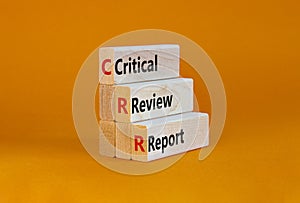 CRR critical review report symbol. Concept words CRR critical review report on blocks on a beautiful orange table, orange