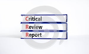 CRR critical review report symbol. Concept words CRR critical review report on books on a beautiful white table, white background