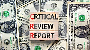 CRR critical review report symbol. Concept words CRR critical review report on wooden blocks on a beautiful background from dollar