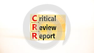 CRR critical review report symbol. Concept words CRR critical review report on wooden blocks on a beautiful white table, white