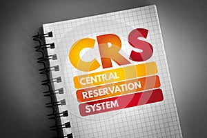 CRS - Central Reservation System acronym on notepad, technology concept background