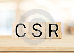 CRS word on wood block background, Corporate social responsibility business concept banner