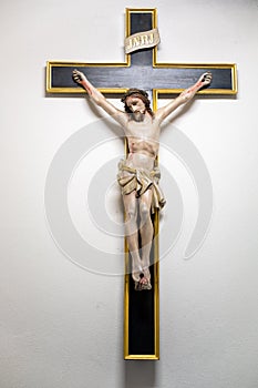 Crucified Jesus with wounds and crown of thorns in old pilgrimage church of Franciscan Monastery Velbert Neviges, Germany
