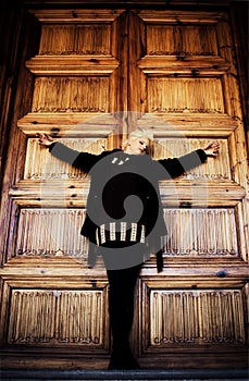 Crucified woman in church wooden door photo