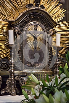 Crucifix with candles in the catholic church